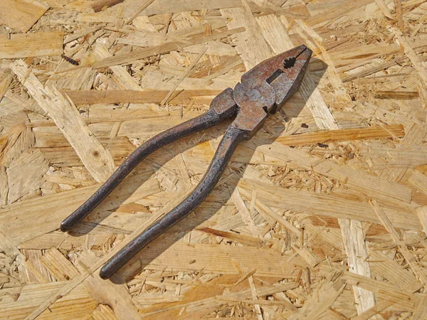 Pliers on a wooden background — Stock Photo, Image