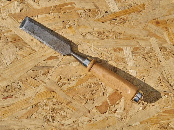Chisel on a wooden background — Stock Photo, Image