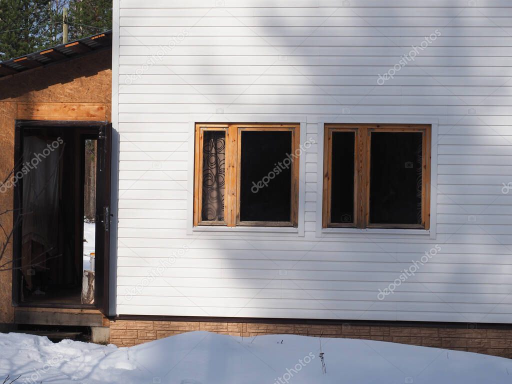 frame house and white siding