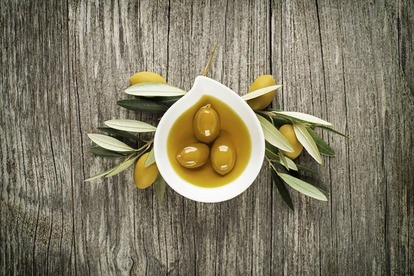 Olive oil with branch — Stock Photo, Image