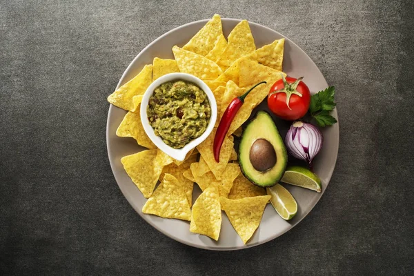 Guacamole sauce with nachos chips — Stock Photo, Image