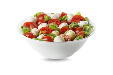 Olgun domatesli lezzetli caprese salatası ve taze fesleğen yapraklı mozzarella peyniri. İtalyan yemeği. Peynirli salata, domates, fesleğen, tuz, karabiber, zeytinyağı.