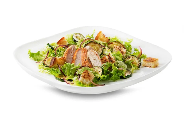 Healthy chicken meal with grilled chicken, vegetables and croutons isolated on white background. Healthy lunch plate.