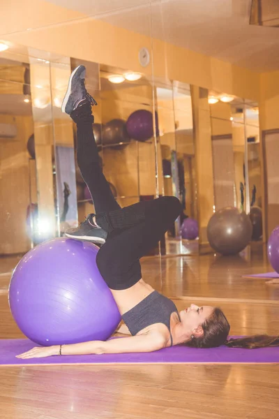 Woman with fitball in gym — Stock Photo, Image