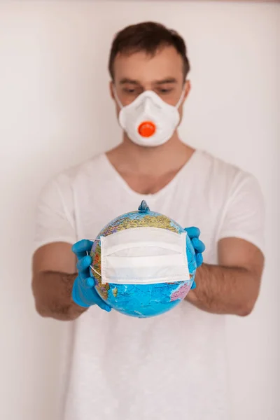 Man Holding Globe Medical Mask Covid Concept — Stock Photo, Image
