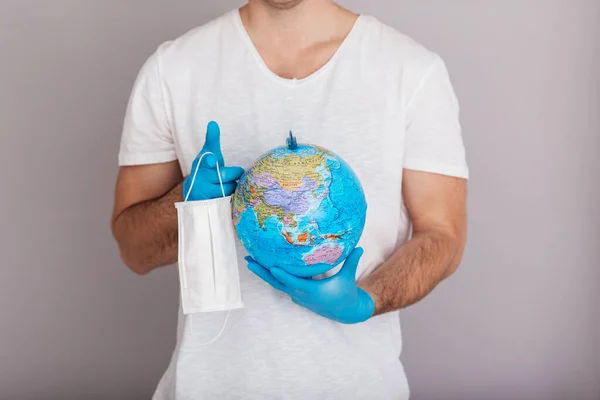 Man Wearing Mask Gloves Holding Globe Covid Concept Isolated White — Stock Photo, Image