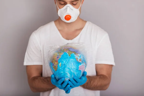 Man Wearing Mask Gloves Holding Globe Plastic Bag Covid Concept — Stock Photo, Image
