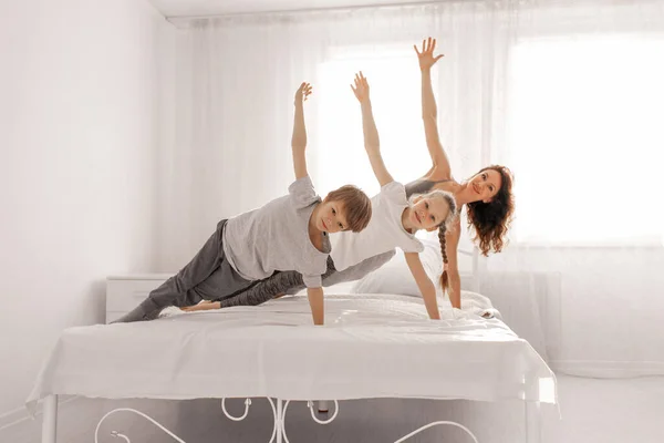 Happy Family Mother Daughter Son Having Fun Home White Bedroom — Stock Photo, Image