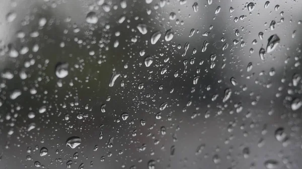 Rain falling on glass during rain storm