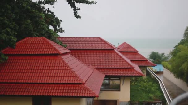 Tropical rain drops falling on roof of the houses in island Koh Samui, Thailand. Seaview. 1920x1080 — Stock Footage Tropical rain drops falling on roof of the houses in island Koh Samui, Thailand. Seaview. 1920x1080 Stock Footage