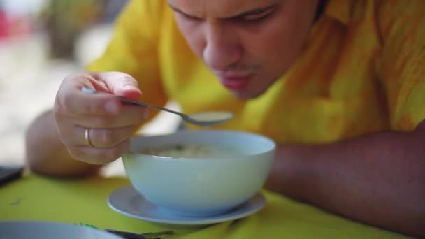 Man eating chicken coconut soup in beach cafe. 1920x1080 — Stock Footage Man eating chicken coconut soup in beach cafe. 1920x1080 Stock Video