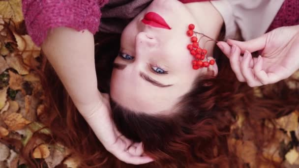 Beautiful Bright Girl With Red Hair And Blue Eyes Lies Over Dry Leaves In Autumn Forest In Slow Motion 3840x2160 Video By C Emaria Stock Footage 184520986