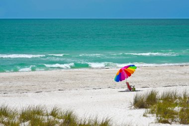 Colorful Beach Umbrella and Chair clipart