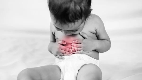 Health problem. asian little girl suffering from stomach pain — Stock Photo, Image