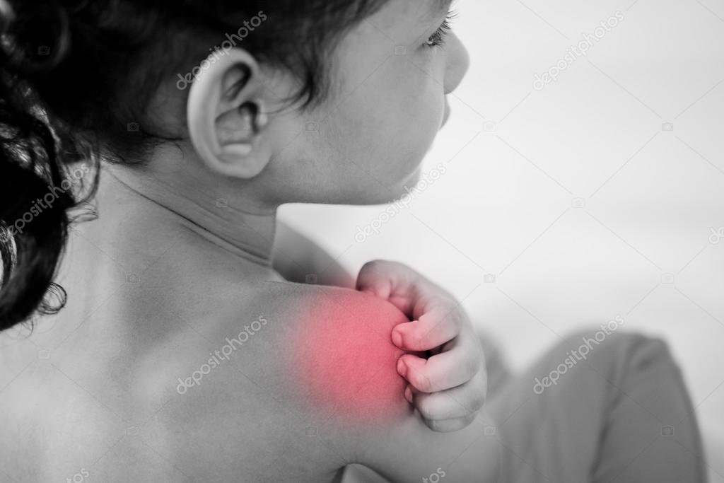 Health problem. asian young girl scratching her itchy shoulder