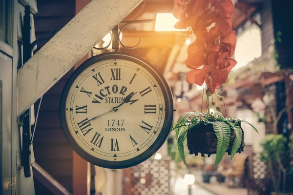 Classic clock in the old town background — Stock Photo, Image