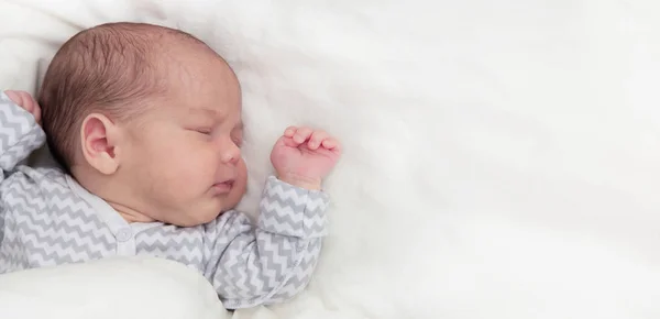 Cute newborn baby sleeping, with space for text