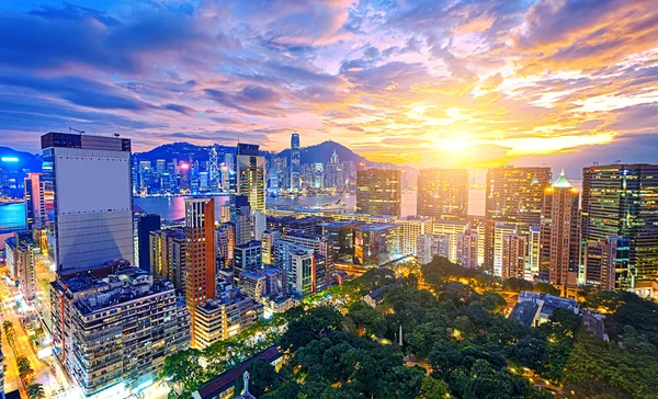 Χονγκ Κονγκ πόλη στο ηλιοβασίλεμα Royalty Free Φωτογραφίες Αρχείου