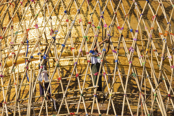 Worker repareing golden temple