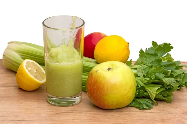 Glass of cocktail with celery and fruit — Stock Photo, Image