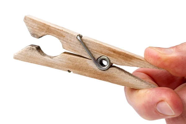 Houten wasknijper in zijn hand — Stockfoto