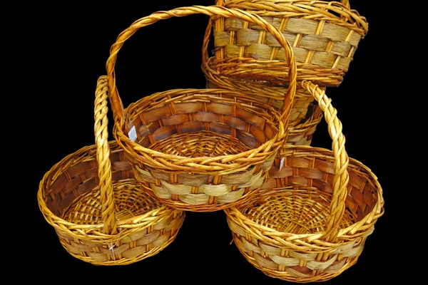 Wicker baskets on black — Stock Photo, Image