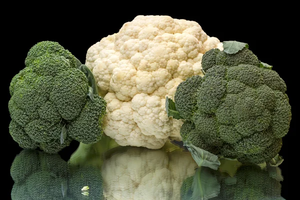 Broccoli and cauliflower on a black — Stock Photo, Image