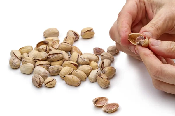 Hands reveal salted pistachios — Stock Photo, Image