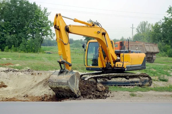 Escavação escavadora amarela — Fotografia de Stock