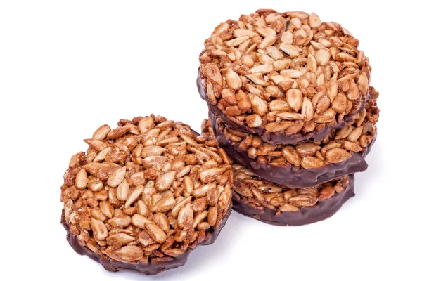 Gozinaki from sunflower seeds on chocolate — Stock Photo, Image