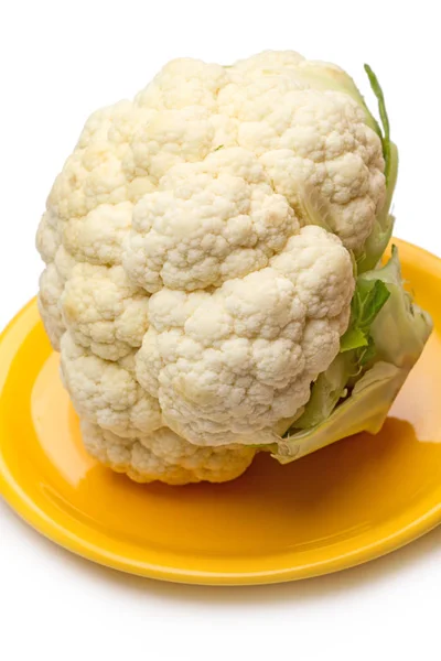 Cauliflower on a yellow plate — Stock Photo, Image