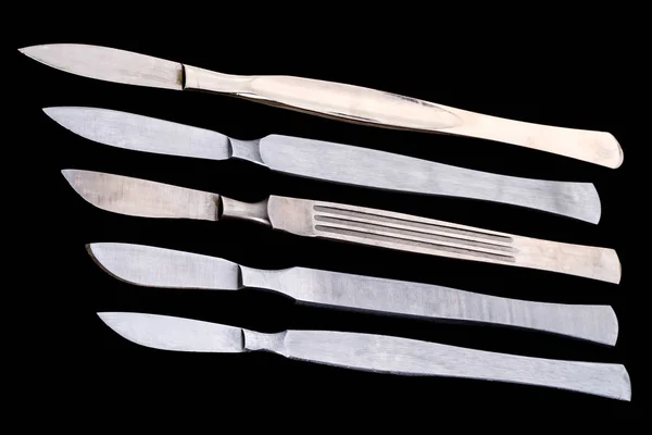 Medical scalpels on black — Stock Photo, Image