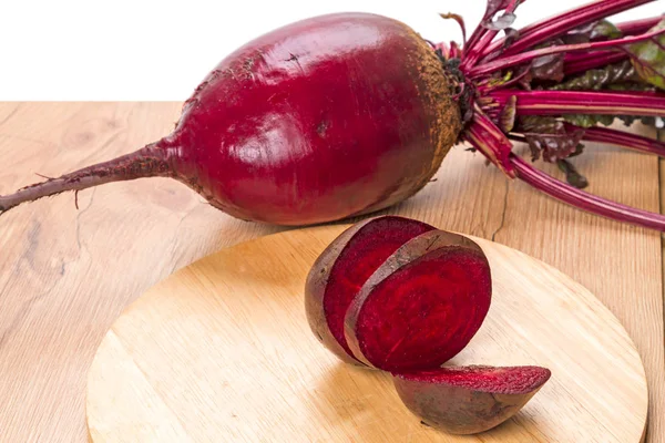 Pieces of red beet on the kitchen board — Stock Photo, Image