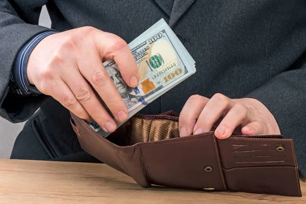 Hands with new hundred dollar bills — Stock Photo, Image