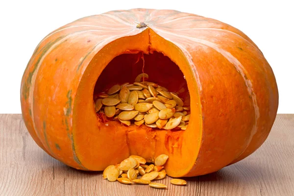 Sliced orange pumpkin with seeds — Stock Photo, Image