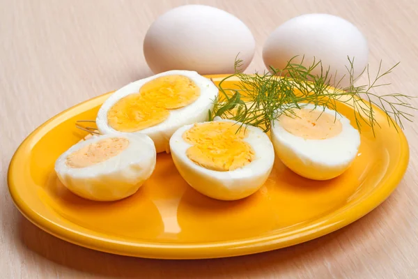 Half cooked eggs on a plate — Stock Photo, Image