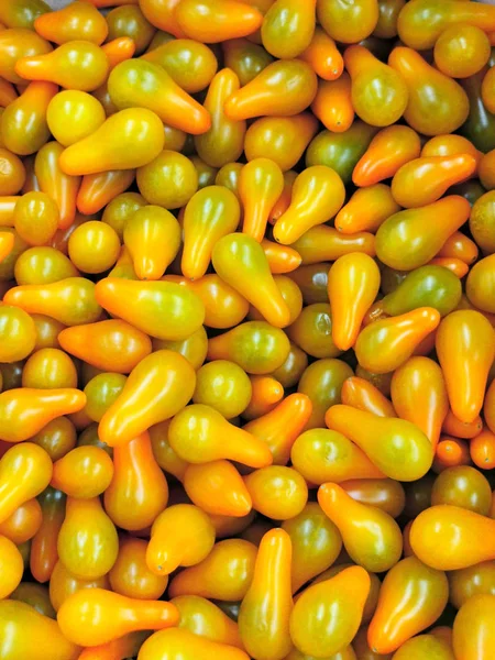 Background of original yellow tomatoes — Stock Photo, Image