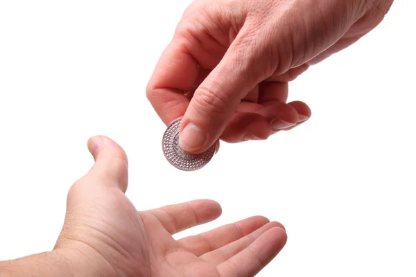 Hand with a silver coin — Stock Photo, Image