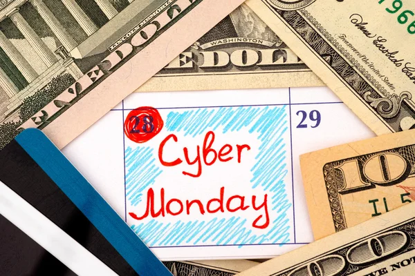 Rappel Cyber Monday en calendrier avec dollars et cartes de crédit — Photo
