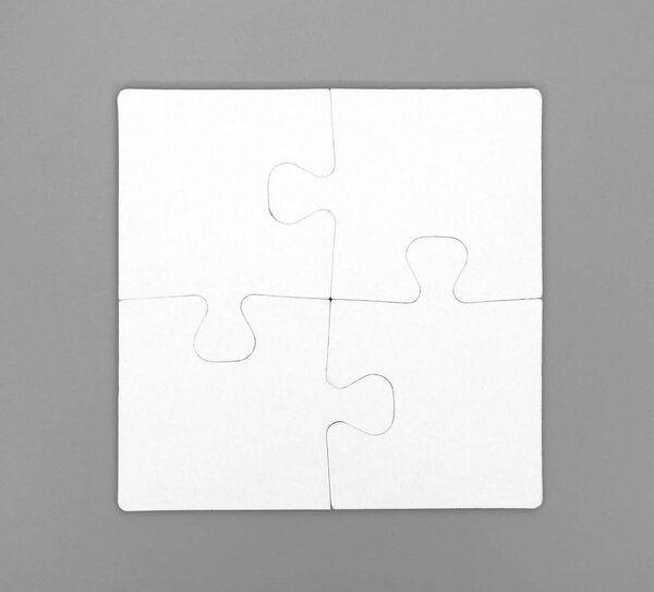 Four pieces of puzzle are connected together. Gray background