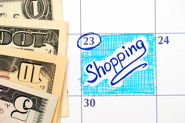 Rappel Shopping dans le calendrier avec des dollars — Photo