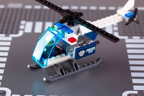 Lego Police helicopter with pilot on baseplate — Stock Photo, Image