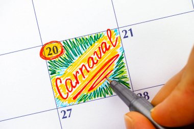 Kadın parmakları ile hatırlatma Carnaval takviminde yazma kalemi