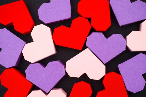 Origami hearts on black background — Stock Photo, Image