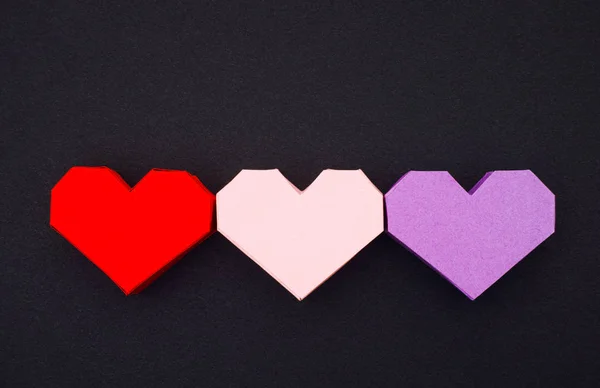 Three origami hearts — Stock Photo, Image