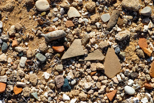 Background of sand with stones and pebbles — Stock Photo, Image