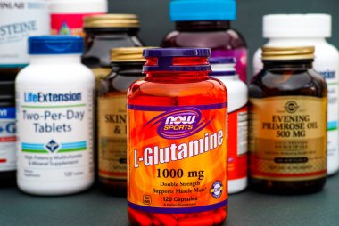Bottle with L-Glutamine by Now Sports. clipart