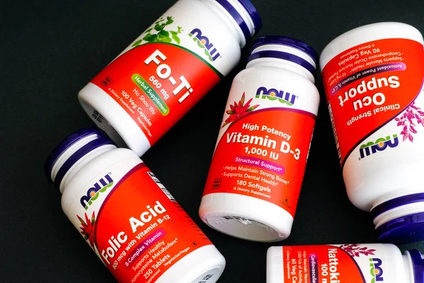Five bottles with dietary supplement by Now. — Stock Photo, Image