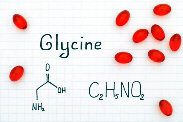 Fórmula química de la glicina con píldoras rojas — Foto de Stock