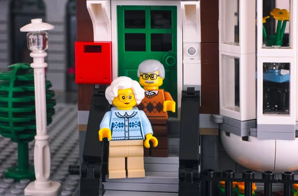 Lego senior couple standing on the porch of their house — Stock Photo, Image